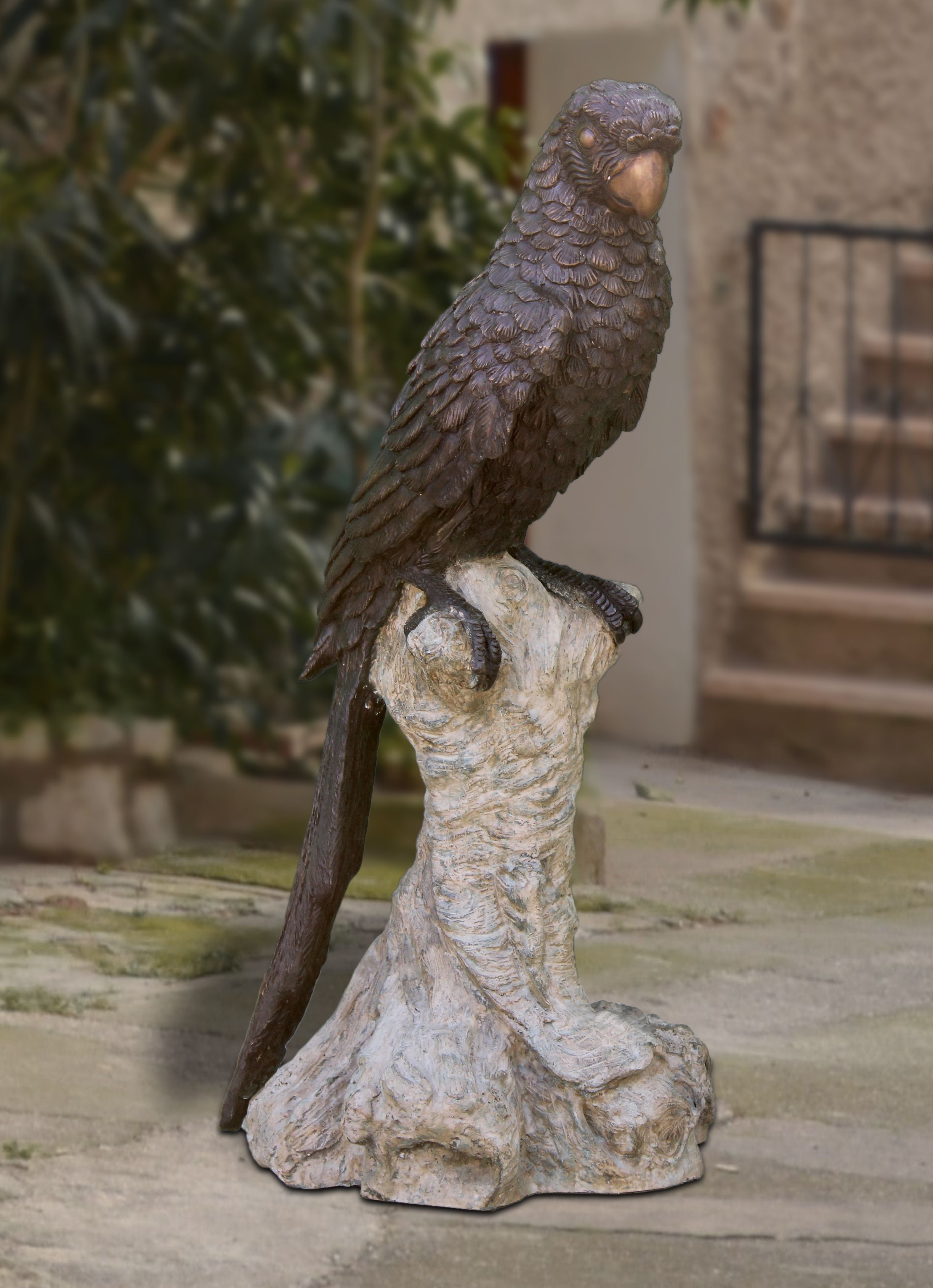 GAZING_PAROT_ON_TREE_BRANCH_BRONZE_STATUE - Cast Stone International 